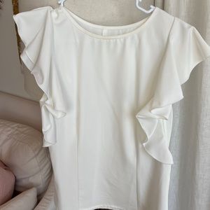 White ruffled top